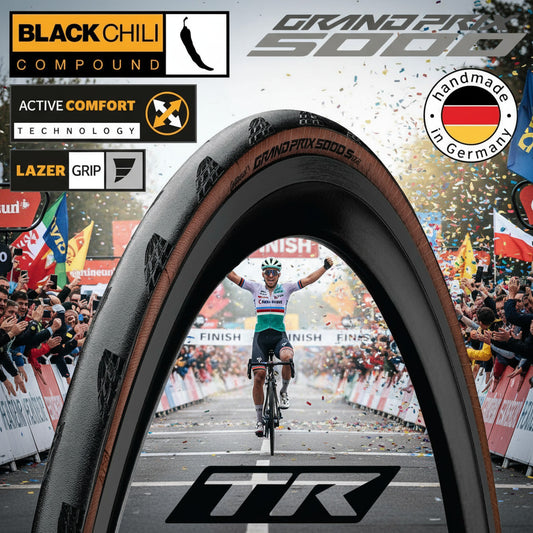 Bicycle tire with Black Chili Compound, Grand Prix 50100 branding, and TR logo on a white background.
